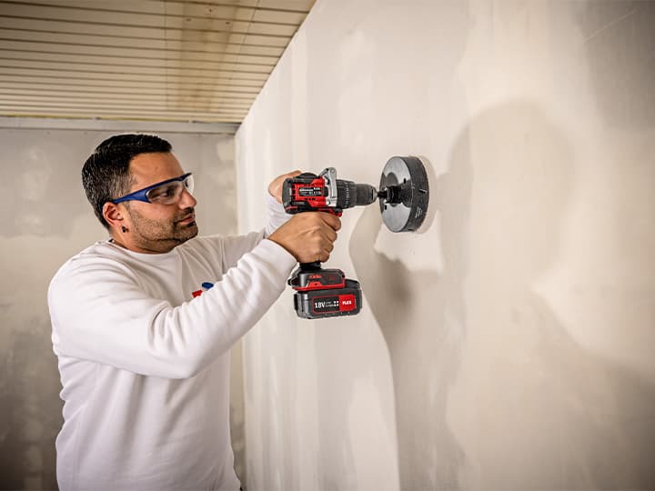 Cordless percussion drill on a construction site